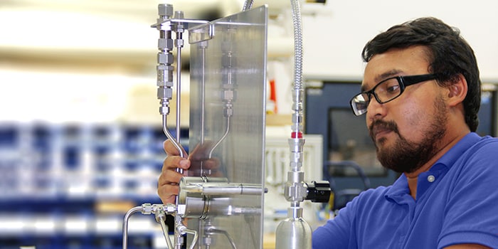 Swagelok engineer assembling a grab sampling panel